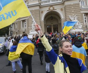 epa10302065 Ukrainians who lived in Kherson and left it due to the Russian occupation, celebrate in downtown of the South Ukrainian city of Odesa, 12 November 2022. Ukrainian troops came into Kherson on 11 November to continue to retake the South of Ukraine from Russian troops. Russian troops entered Ukraine on 24 February 2022 starting a conflict that has provoked destruction and a humanitarian crisis.  EPA/STR