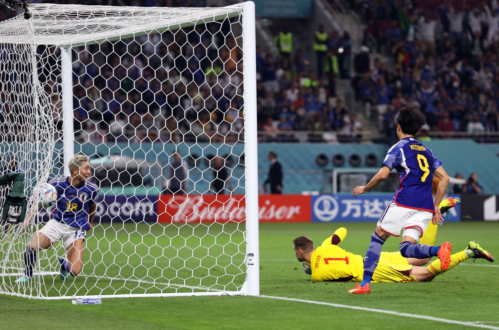 epa10322687 Germany's goalkeeper Manuel Neuer (2-R) concedes Japan's 1-1 equalizer during the FIFA World Cup 2022 group E soccer match between Germany and Japan at Khalifa International Stadium in Doha, Qatar, 23 November 2022.  EPA/Tolga Bozoglu