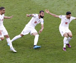 epa10327218 Rouzbeh Cheshmi (C) of Iran celebrates with teammates after scoring the opening goal during the FIFA World Cup 2022 group B soccer match between Wales and Iran at Ahmad bin Ali Stadium in Doha, Qatar, 25 November 2022.  EPA/Rungroj Yongrit