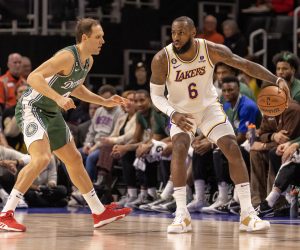 Dec 11, 2022; Detroit, Michigan, USA; Los Angeles Lakers forward LeBron James (6) controls the ball as Detroit Pistons forward Bojan Bogdanovic (44) defends during the in the first half at Little Caesars Arena. Mandatory Credit: David Reginek-USA TODAY Sports