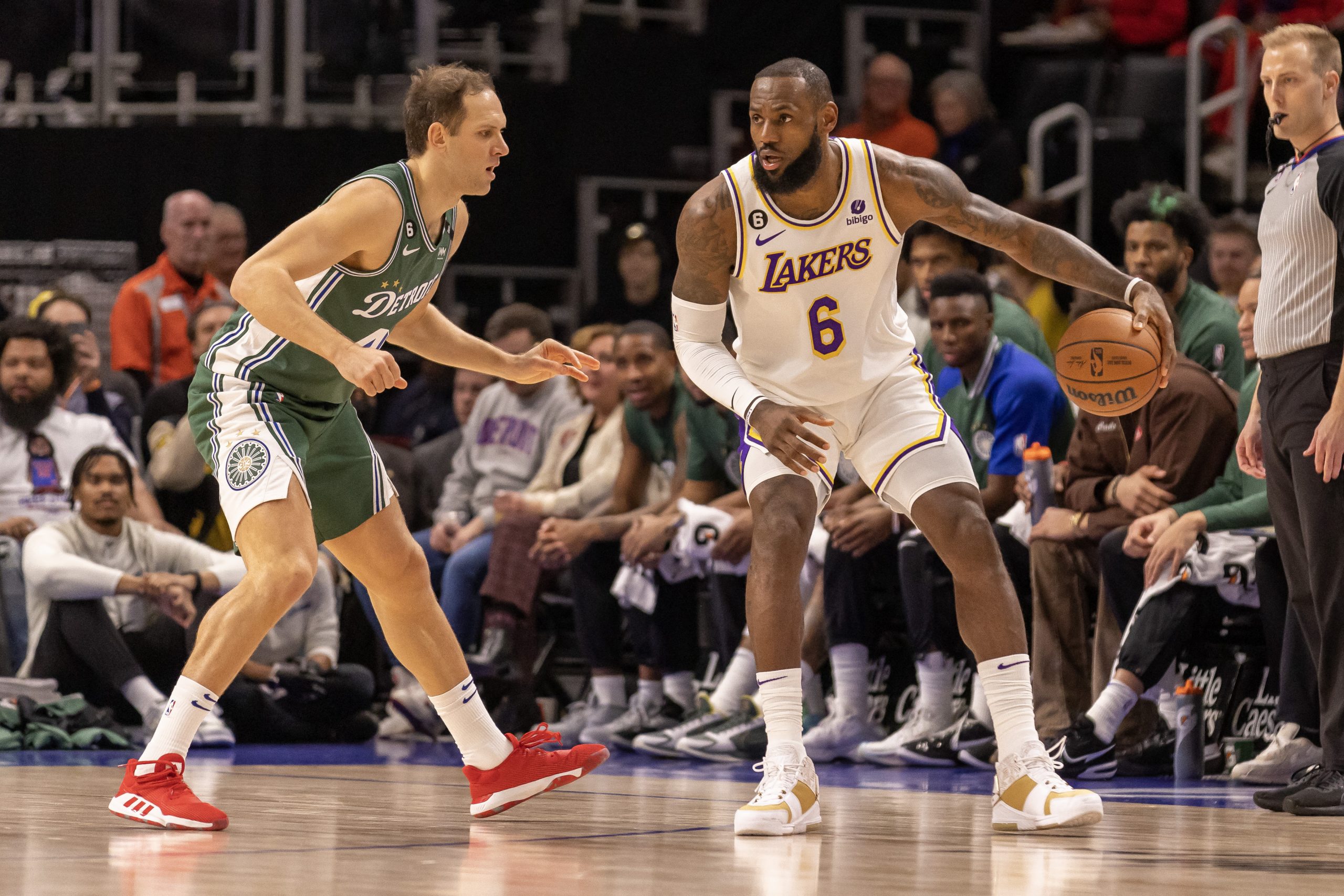 Dec 11, 2022; Detroit, Michigan, USA; Los Angeles Lakers forward LeBron James (6) controls the ball as Detroit Pistons forward Bojan Bogdanovic (44) defends during the in the first half at Little Caesars Arena. Mandatory Credit: David Reginek-USA TODAY Sports