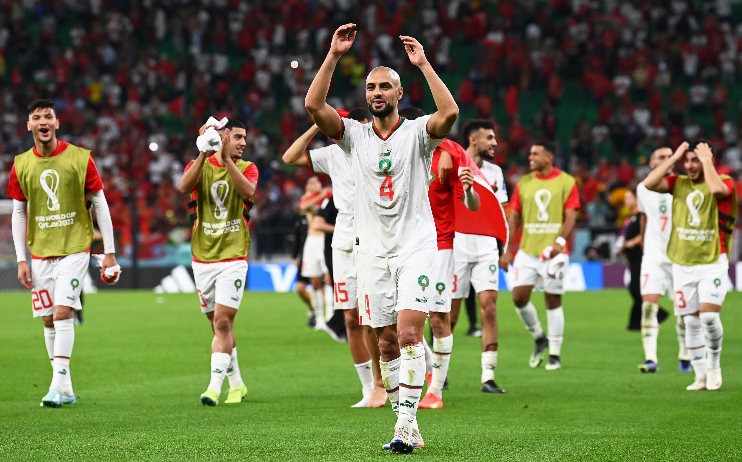 epa10332482 Sofyan Amrabat (C) of Morocco and teammates celebrate after winning the FIFA World Cup 2022 group F soccer match between Belgium and Morocco at Al Thumama Stadium in Doha, Qatar, 27 November 2022.  EPA/Georgi Licovski