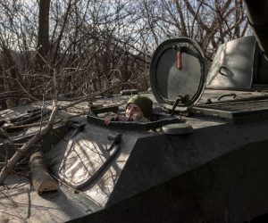 epa10345159 A Ukrainian soldier looks out from a self-propelled howitzer 2S1 Gvozdika near the frontline town of Bakhmut, in Donetsk region, Ukraine, 02 December 2022. Bakhmut, has been a place of fierce fighting between the Ukrainian and Russian troops with a large number of casualties. Russian troops entered Ukraine on 24 February 2022 starting a conflict that has provoked destruction and a humanitarian crisis.  EPA/ROMAN PILIPEY