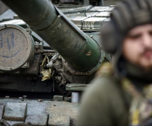 epaselect epa10413476 A Ukrainian soldier stands beside a T-72 tank in the Donetsk region, eastern Ukraine, 18 January 2023. Britain’s defence secretary Ben Wallace confirmed on Monday that the UK would send Ukraine 14 of its own Challenger 2 tanks. Russian troops entered Ukraine on 24 February 2022 starting a conflict that has provoked destruction and a humanitarian crisis.  EPA/OLEG PETRASYUK