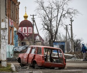 epa10420775 A man walks on the street in retaken village Drobysheve, Donetsk region, eastern Ukraine, 21 January 2023. Russian troops entered Ukraine on 24 February resulting in fighting and destruction in the country and triggering a series of severe economic sanctions on Russia by Western countries.  EPA/OLEG PETRASYUK