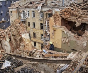 epa10439912 Ukrainian rescuers work on a residential building hit in Russian overnight shelling in Kharkiv, Ukraine, 30 January 2023. At least one woman was killed and three people were injured in the shelling, according to the Ukrainian Emergency Service. Kharkiv and surrounding areas have been the target of heavy shelling since February 2022, when Russian troops entered Ukraine territory starting an armed conflict that has provoked destruction and a humanitarian crisis.  EPA/SERGEY KOZLOV