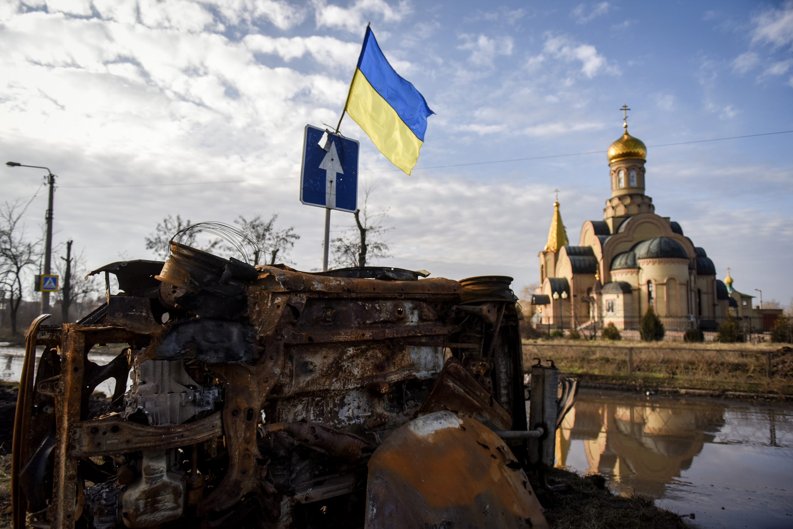 epa10416126 A Ukrainian flag posted on the wreckage of a motor vehicle in Bakhmut, Donetsk region, eastern Ukraine, 19 January 2023. Ukrainian authorities are urging residents to evacuate from the frontline territories, though some 8,000 have chosen to stay in their homes. There is no working infrastructure left - no electricity, heating, water or gas. Also the risk to be injured or killed by Russian shelling remains high, so that people mostly spend their time in shelters or basements. Russian troops entered Ukraine on 24 February 2022 starting a conflict that has provoked destruction and a humanitarian crisis.  EPA/OLEG PETRASYUK