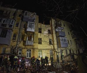 epa10439913 Ukrainian rescuers work on a residential building hit in Russian overnight shelling in Kharkiv, Ukraine, 30 January 2023. At least one woman was killed and three people were injured in the shelling, according to the Ukrainian Emergency Service. Kharkiv and surrounding areas have been the target of heavy shelling since February 2022, when Russian troops entered Ukraine territory starting an armed conflict that has provoked destruction and a humanitarian crisis.  EPA/SERGEY KOZLOV