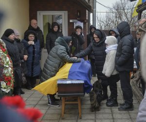 epa10465058 Relatives, friends, and comrades attend the funeral ceremony for Ukrainian serviceman Andriy Gnitetskiy, in Hostomel, near Kyiv (Kiev), Ukraine, 13 February 2023. Andriy Gnitetskiy was killed in fighting near the frontline city of Soledar, eastern Ukraine. Russian troops on 24 February 2022 entered Ukrainian territory, starting an armed conflict that has provoked destruction and a humanitarian crisis.  EPA/ANDRII NESTERENKO