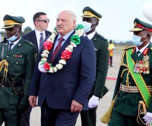 epa10440306 Belarusian President Alexander Lukashenko (C) inspects guards of honor upon arrival at the Robert Mugabe International airport in Harare, Zimbabwe, 30 January 2023. Lukashenko arrived on a two-day state visit to Zimbabwe, the first by Lukashenko to a Sub-Saharan African nation, during which he will have talks on strengthening bilateral ties.  EPA/AARON UFUMELI