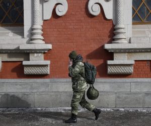 epa10496985 A man in a camouflage uniform walks past in Moscow, Russia, 01 March 2023. The European Union on 25 February introduced the 10th package of sanctions against Russia. The restrictions will affect the banking sector, advanced technologies, as well as the private military company (PMC) 'Wagner'. On 24 February 2022 Russian troops entered the Ukrainian territory in what the Russian president declared to be a 'Special Military Operation', starting an armed conflict.  EPA/YURI KOCHETKOV