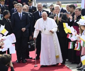 epa10596011 Pope Francis greets faithfuls as he arrives for his three-day Apostolic visit to Hungary, at Liszt Ferenc International Airport in Budapest, Hungary, 28 April 2023.  EPA/TAMAS KOVACS HUNGARY OUT