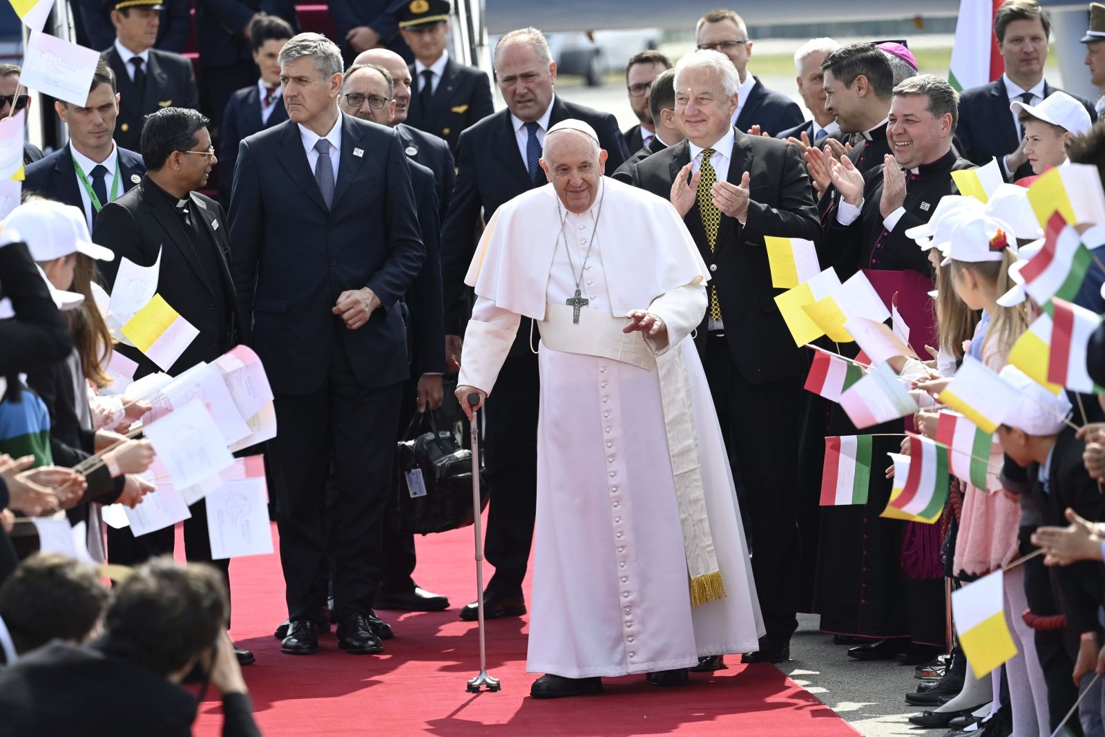 epa10596011 Pope Francis greets faithfuls as he arrives for his three-day Apostolic visit to Hungary, at Liszt Ferenc International Airport in Budapest, Hungary, 28 April 2023.  EPA/TAMAS KOVACS HUNGARY OUT