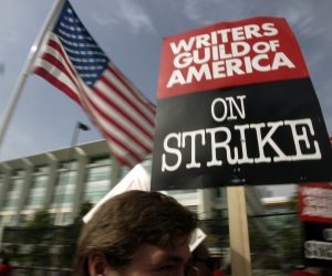 FILE - Writers Guild of America (WGA) writers and others strike against the Alliance of Motion Picture and Television Producers (AMPTP) in a rally at Fox Plaza in Los Angeles' Century City district on Nov. 9, 2007. Television and movie writers on Monday, May 1, 2023, declared that they will launch an industrywide strike for the first time since 2007, as Hollywood girded for a shutdown in a dispute over fair pay in the streaming era. (AP Photo/Reed Saxon, File)