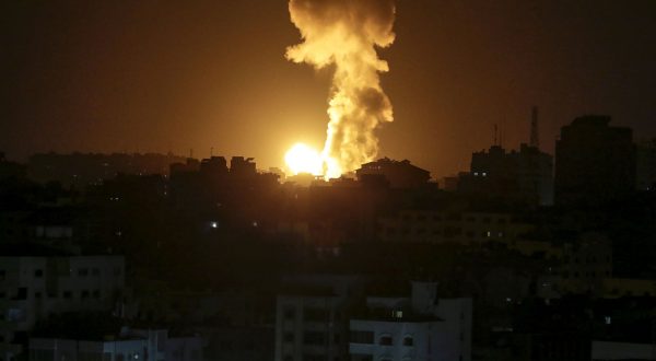 epa10605240 Smoke rises after Israeli air strike in the northern Gaza strip, in Gaza City, early 03 May 2023.  EPA/MOHAMMED SABER