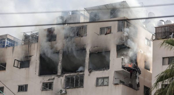 epa10623308 Smoke comes out from the department of Iyad Al-Hasani, the leader of Al-Quds Brigades, the armed wing of the Palestinian Islamic Jihad, after an Israeli air strike in Gaza city, 12 May 2023. According to Israel Defense Forces, Al-Hasani and his bodyguard were killed after the Israeli air strike.  EPA/HAITHAM IMAD