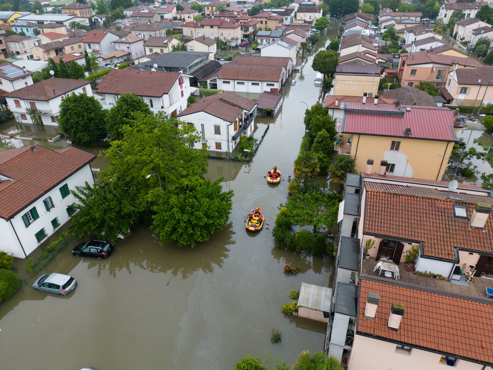 epa10638276 An aerial view of Italian firefighters' rescue teams searching for people trapped in their houses in Lugo, Italy, 19 May 2023. The death toll from this week's deadly flooding in the northeastern region of Emilia Romagna has climbed to 14 after the police recovered the body of a man in his 70s in Faenza on early May 19.  EPA/EMANUELE VALERI