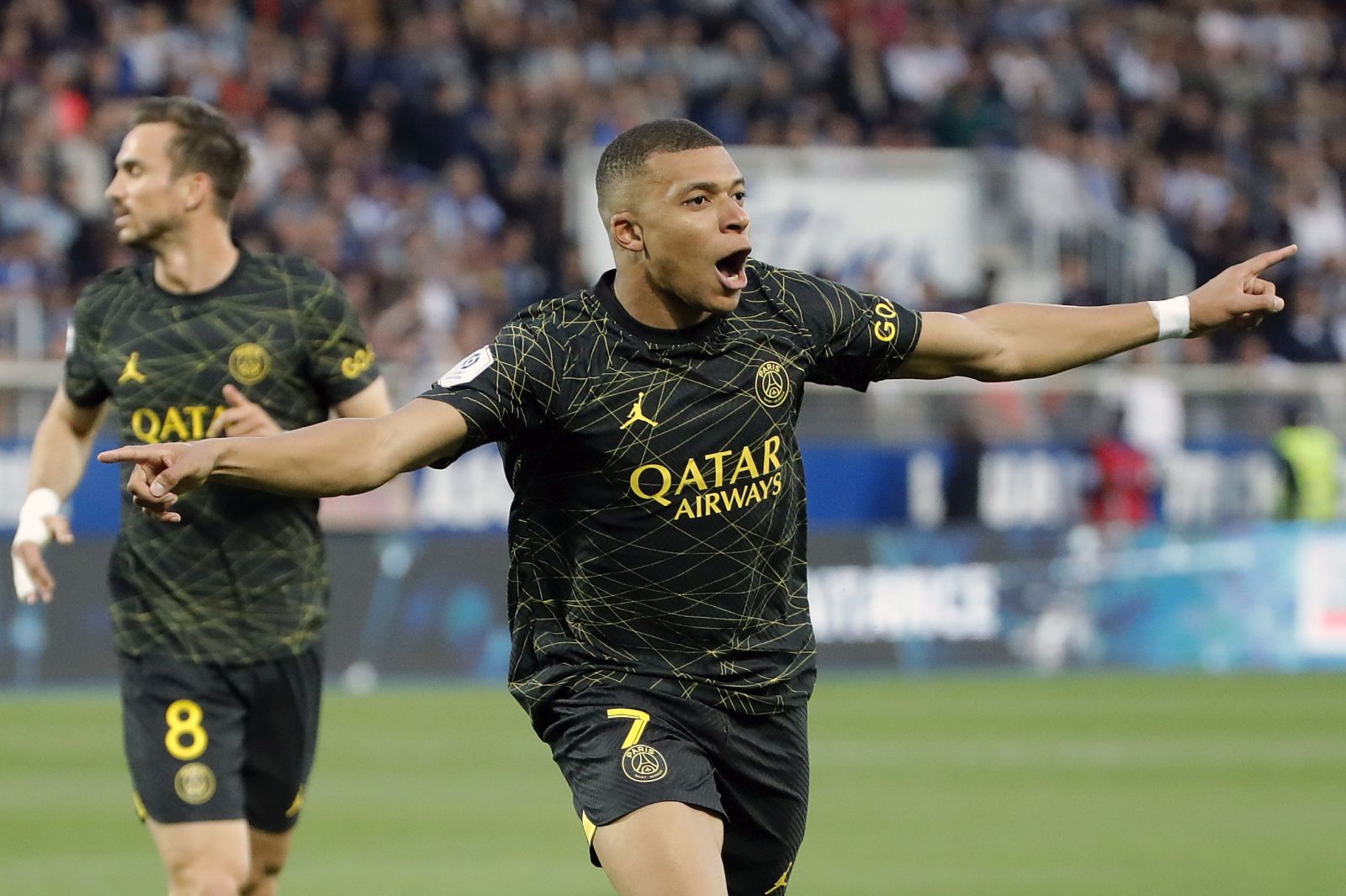 epa10644619 Paris Saint Germain's Kylian Mbappe celebrates after scoring during the French Ligue 1 soccer match between AJ Auxerre and Paris Saint-Germain in Auxerre, France, 21 May 2023.  EPA/TERESA SUAREZ