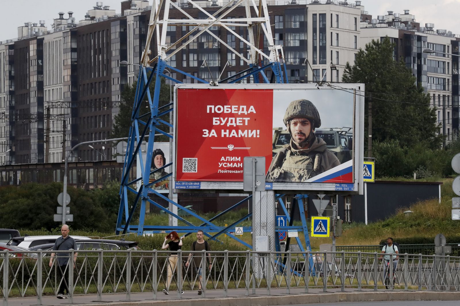 epa10712490 People walk past billboards depicting soldiers and carrying slogans reading 'The victory will be ours!' in St. Petersburg, Russia, 26 June 2023. On 24 June, counter-terrorism measures were enforced in Moscow and other Russian regions after private military company (PMC) Wagner Group chief Yevgeny Prigozhin claimed that his troops had occupied the building of the headquarters of the Southern Military District in Rostov-on-Don, demanding a meeting with Russia's defense chiefs. Belarusian President Lukashenko, a close ally of Putin, negotiated a deal with Wagner chief Prigozhin to stop the movement of the group's fighters across Russia, the press service of the President of Belarus reported. The negotiations were said to have lasted for the entire day. Prigozhin announced that Wagner fighters were turning their columns around and going back in the other direction, returning to their field camps.  EPA/ANATOLY MALTSEV