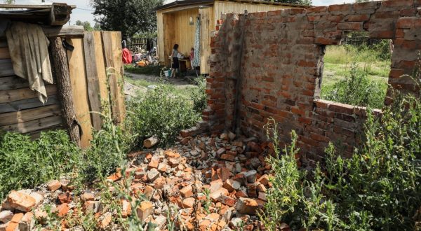 epa10733789 A view of the family destroyed home (Foreground) as siblings Julia and Vita play near their family's temporary module shelter (Background) at Kukhari village, Kyiv Region, Ukraine, 05 July 2023 (issued 08 July 2023). The village of Kukhari is located some 100 km north of Kyiv. Before the war there were 463 households, 78 of them were destroyed during active combat in the region. One of these was Zaritsky's family house. On 10 March 2022, Igor Zaritsky (39), his wife Olga (37), and their three children, Julia (16), Yehor (10) and Vita (3), hid from shelling in the basement of their house, when it was damaged and began to burn. Their neighbor helped Olga and the children to escape to the nearby village of Zarudddia, where Igor found them the next day. Later they traveled to Malyn, Zhytomyr, Zviahil, stopping at relatives and friends' places. After the Russian army was forced out from the Kyiv region in April 2022, the local population slowly returned to their villages. The Zaritsky family returned to their home on 08 May. Near their destroyed house, they built a makeshift shelter, where they spent the summer. Later in Autumn, they moved to a temporary module house, given to them as humanitarian aid, where they spent one winter. Step by step, they try to manage their life in the unusual conditions and rebuild a house for them to return to a more normal life. They bought a horse they named Javelina (Olyk, the horse they previously had was killed in a shelling), and are waiting for a possible humanitarian grant, to buy a cow which can cost as much as 1000 euros. Their two elder children attend school online since the war started, on top of their home, the school had also been destroyed in a shelling, they are now on summer vacations so they help their parents to care for their younger sibling, and with the household chores. Igor, the dad, works as a forester, his wife Olga who used to work as a post office Manager, is now a stay at home mum, sometimes doing