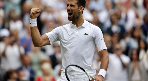 epa10740354 Novak Djokovic of Serbia celebrates after winning the match point against Andrey Rublev of Russia during their Men's Singles quarter final match at the Wimbledon Championships, Wimbledon, Britain, 11 July 2023.  EPA/TOLGA AKMEN   EDITORIAL USE ONLY