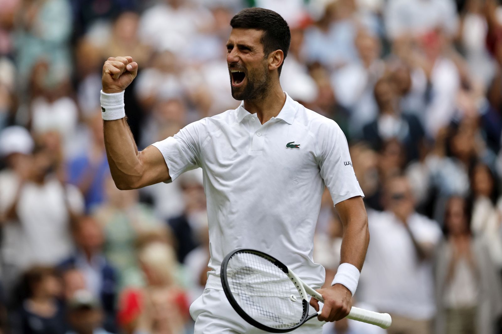 epa10740354 Novak Djokovic of Serbia celebrates after winning the match point against Andrey Rublev of Russia during their Men's Singles quarter final match at the Wimbledon Championships, Wimbledon, Britain, 11 July 2023.  EPA/TOLGA AKMEN   EDITORIAL USE ONLY