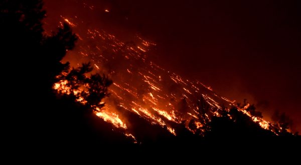 epa10765116 A wildfire burns at the Trapeza village, in Achaia Peloponnese, Greece, 23 July 2023. There is an extreme, category 5, fire risk high alert also for 24 July, for five Greek regions of Attica, Central Greece, the Peloponnese, Western Greece and southern Aegean with the island of Rhodes, according to the Fire Risk Forecast Map issued by the General Secretariat for Civil Protection at the climate crisis and civil protection ministry.  EPA/GIOTA LOTSARI