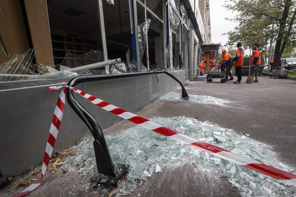 epaselect epa10765568 Municipal workers clean near a damaged building after a drone attack in Moscow, Russia, 24 July 2023. The Russian Ministry of Defense on 24 July accused Ukraine of carrying out an attack with two unmanned aerial vehicles (UAV) against facilities in Moscow, adding that the attack was foiled and the two UAVs 'were suppressed by means of electronic warfare and crashed' leaving no casualties.  EPA/YURI KOCHETKOV