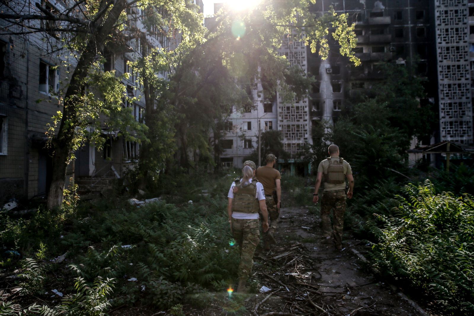 epa10750412 Ukrainian servicemen from the 72 Mechanized cross a yard in Vuhledar town, Donetsk region, Ukraine, 16 July 2023. Located in the southern part of Donetsk region, Vuhledar is a frontline town. Before Russia's ongoing invasion of Ukraine, the population of the town was 14432 citizens. Currently, less than 100 citizens live there, based on different calculations and since 24 February 2022, 59 citizens, including three children, have been killed. There are no buildings that are not damaged or ruined, there is no infrastructure, no water and no electricity. The Russian army tried to assault Ukrainian positions around the town, but were unsuccessful. Russian troops entered Ukraine on 24 February 2022 starting a conflict that has provoked destruction and a humanitarian crisis.  EPA/OLEG PETRASYUK  ATTENTION: This Image is part of a PHOTO SET