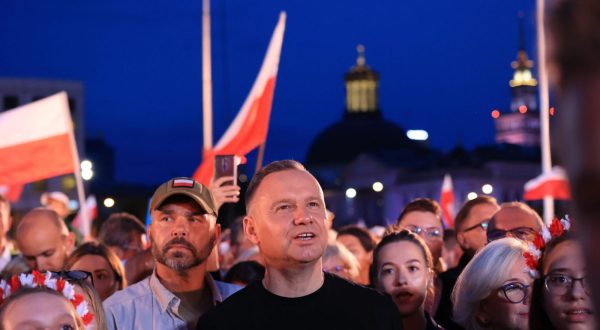 epa10780411 Polish President Andrzej Duda (C) attends a patriotic concert during the 79th anniversary of the outbreak of Warsaw Uprising at Jozef Pilsudski Square in Warsaw, Poland, 01 August 2023. The Warsaw Uprising started on 01 August 1944 as the biggest resistance operation in Nazi-occupied Europe. Initially intended to last several days, it continued for over two months before being suppressed by the Germans. The uprising claimed the lives of about 18,000 insurgents and around 180,000 civilians.  EPA/Szymon Pulcyn POLAND OUT