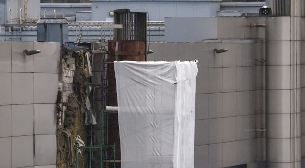 epa10805374 A damaged part of the Expocentre exhibition centre building after a drone reportedly fell in Moscow, Russia, 18 August 2023. According to the Russian Ministry of Defense, air defense systems on 18 August shot a drone causing a change of its flight trajectory before falling on a non-residential building near Krasnopresnenskaya Embankment in Moscow. The Russian Defense Ministry blamed Ukraine for the attack that left no casualties. Moscow Mayor Sergei Sobyanin said the drone fell in the Expocentre zone and no significant damage was caused to the building.  EPA/SERGEI ILNITSKY