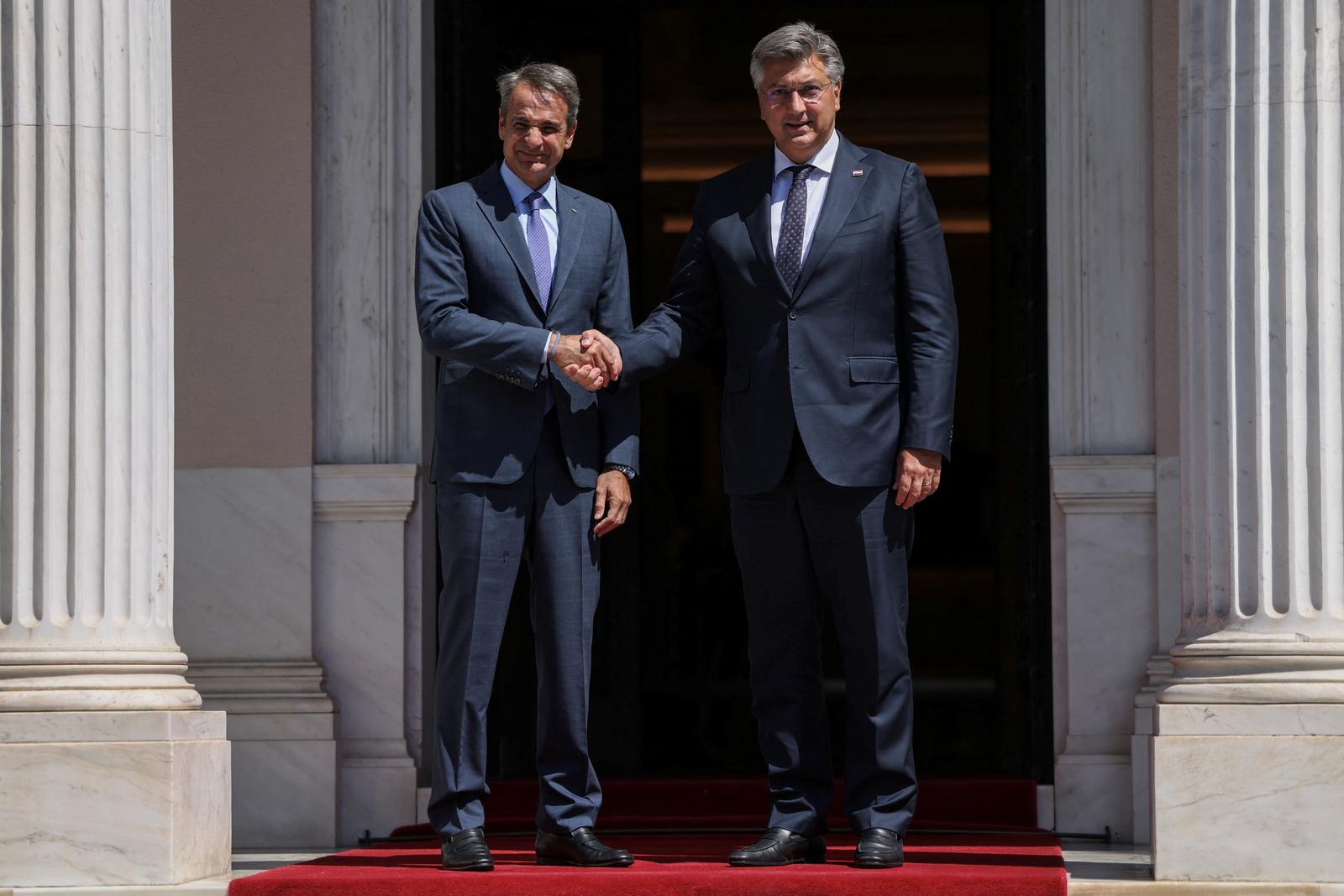 Greek Prime Minister Kyriakos Mitsotakis welcomes Croatia's Prime Minister Andrej Plenkovic at the Maximos Mansion in Athens, Greece, August 21, 2023. REUTERS/Stelios Misinas Photo: STELIOS MISINAS/REUTERS