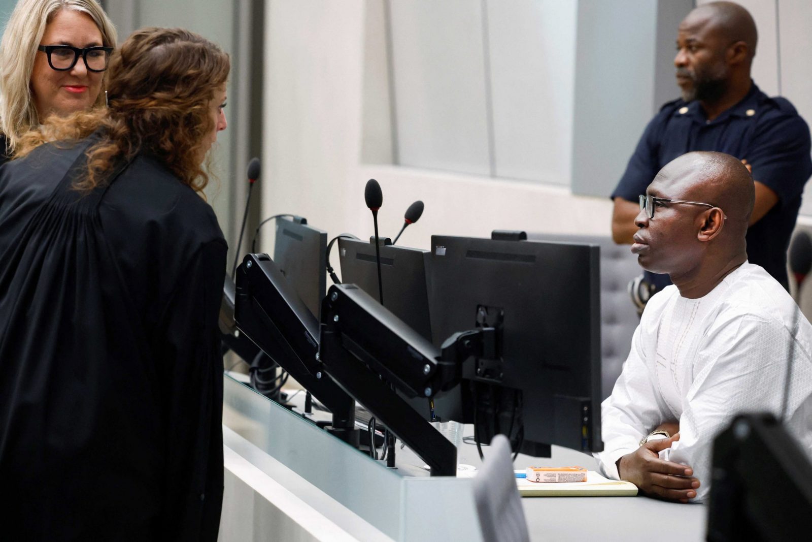 epa10813230 Former Minister of Disarmament of the Central African Republic Maxime Jeoffroy Eli Mokom Gawaka (R) during the session at the International Criminal Court (ICC) in The Hague, the Netherlands, 22 August 2023. Mokom is suspected of having committed several war crimes against citizens of the Central African Republic.  EPA/PIROSCHKA VAN DE WOUW / POOL