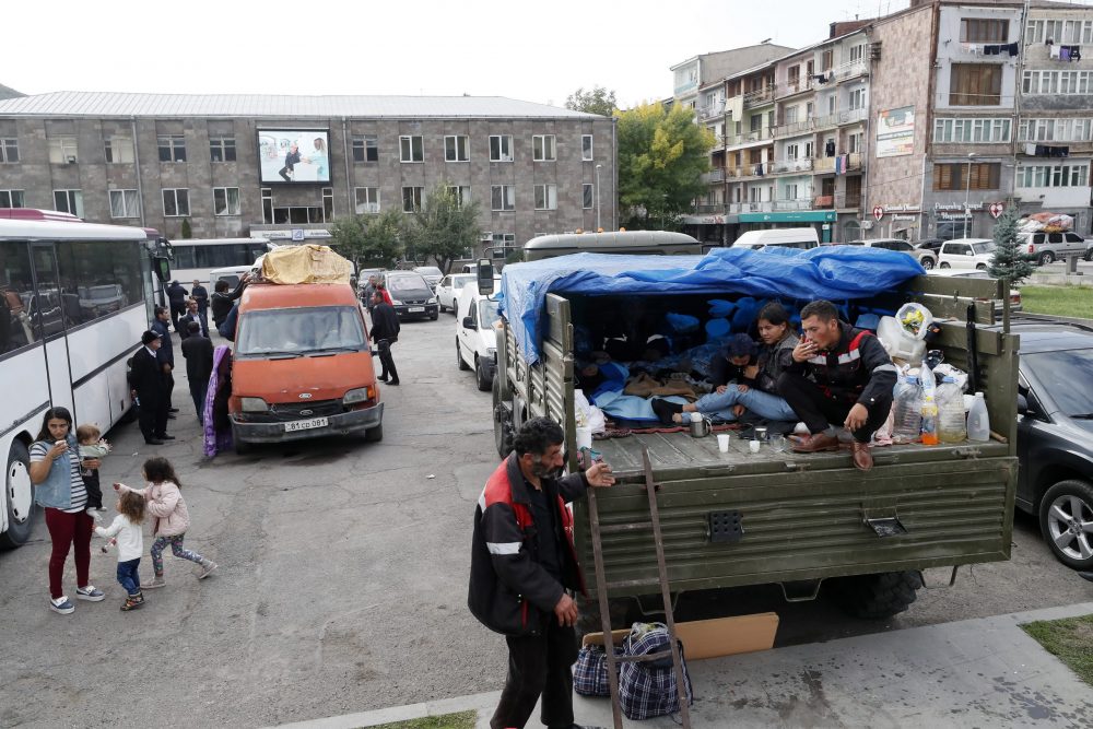 epa10889132 Ethnic Armenians from Nagorno-Karabakh gather near the registration and distribution center in Goris, Armenia, 29 September 2023. Azerbaijan on 19 September 2023 launched a brief military offensive on the contested region of Nagorno-Karabakh, a breakaway enclave that is home to some 120,000 ethnic Armenians. Following a ceasefire agreed on 20 September 2023, Azerbaijan opened all checkpoints with Armenia for the unimpeded exit of civilians from the disputed territory. The Armenian government announced the evacuation of more than 85,000 local residents from Nagorno-Karabakh, and a humanitarian center has been set up in the village of Kornidzor near the so-called Lachin corridor, the main route between Armenia and the breakaway region. Nagorno-Karabakh will cease to exist as a self-proclaimed state from 01 January 2024, the region's separatist leader, Samvel Shakhramanyan, announced on 28 September, after signing a decree to dissolve all its institutions.  EPA/ANATOLY MALTSEV