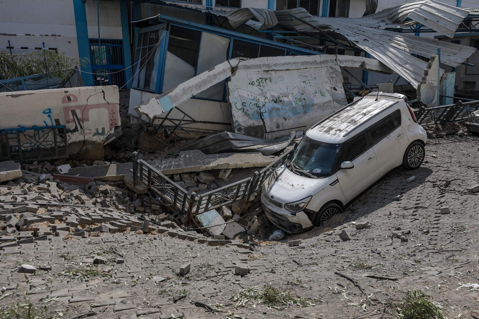 epa10907164 The damaged UNRWA school building in Gaza City, 08 October 2023, following Israeli air strikes. The air strikes, in retaliation for the 07 October Hamas rocket attacks on Israel, have killed over 300 people in the Gaza Strip, with almost 2,000 wounded, according to Palestinian official sources.  EPA/MOHAMMED SABER