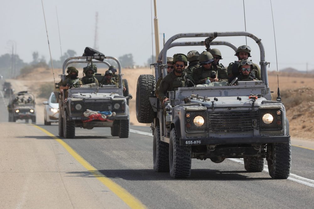 epa10912985 Israeli soldiers drive along the border with Gaza near the southern city of Ofakim ,11 October 2023. More than 1,200 Israelis have been killed and over 2,800 others injured, according to the Israel Defense Forces (IDF), since the Islamist movement Hamas launched attacks on Israel from the Gaza Strip on 07 October. More than 3,000 people, including 1,500 militants from Hamas, have been killed and thousands injured in both Gaza and Israel since the conflict erupted, according to Israeli military sources and Palestinian officials.  EPA/ABIR SULTAN