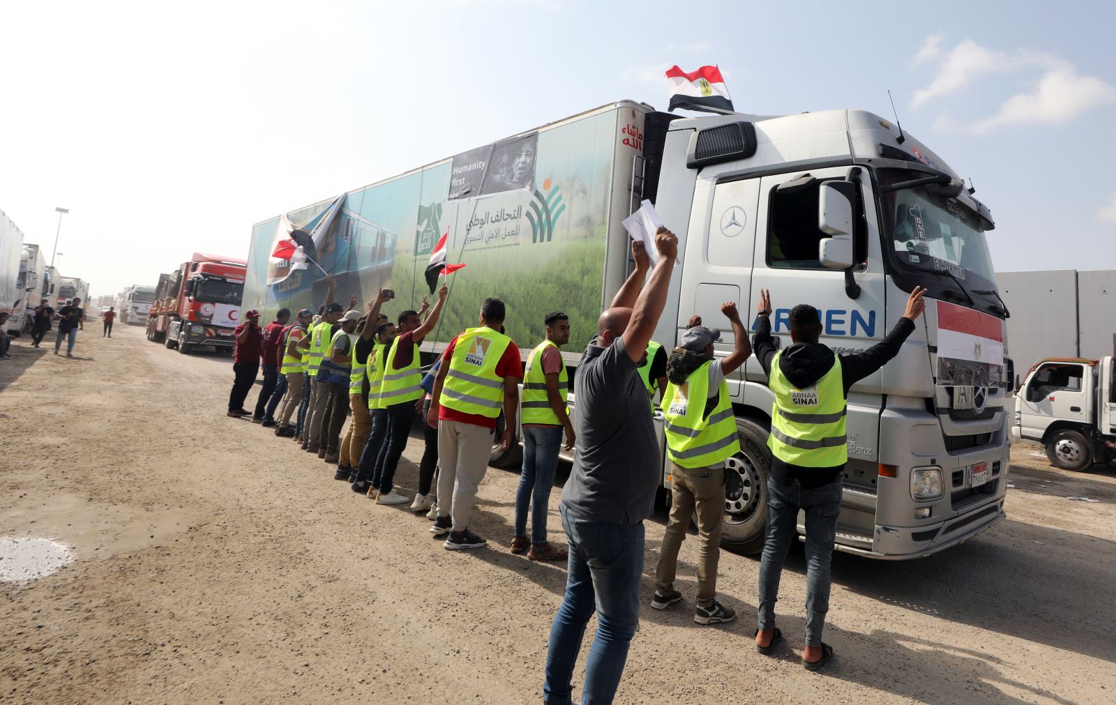 epa10932627 A truck carrying humanitarian aid for the Gaza Strip crosses the Rafah border gate, in Rafah, Egypt, 22 October 2023. Following negotiations between Egypt, the US, and Israel to allow relief aid to enter the Gaza Strip, some 20 aid trucks carrying food, water, and medicine were allowed into the Gaza Strip through the Rafah land crossing on 21 October. 17 more aid trucks were allowed in on 22 October, but UN agencies said it was far from sufficient and many more were needed to be allowed in.  EPA/KHALED ELFIQI