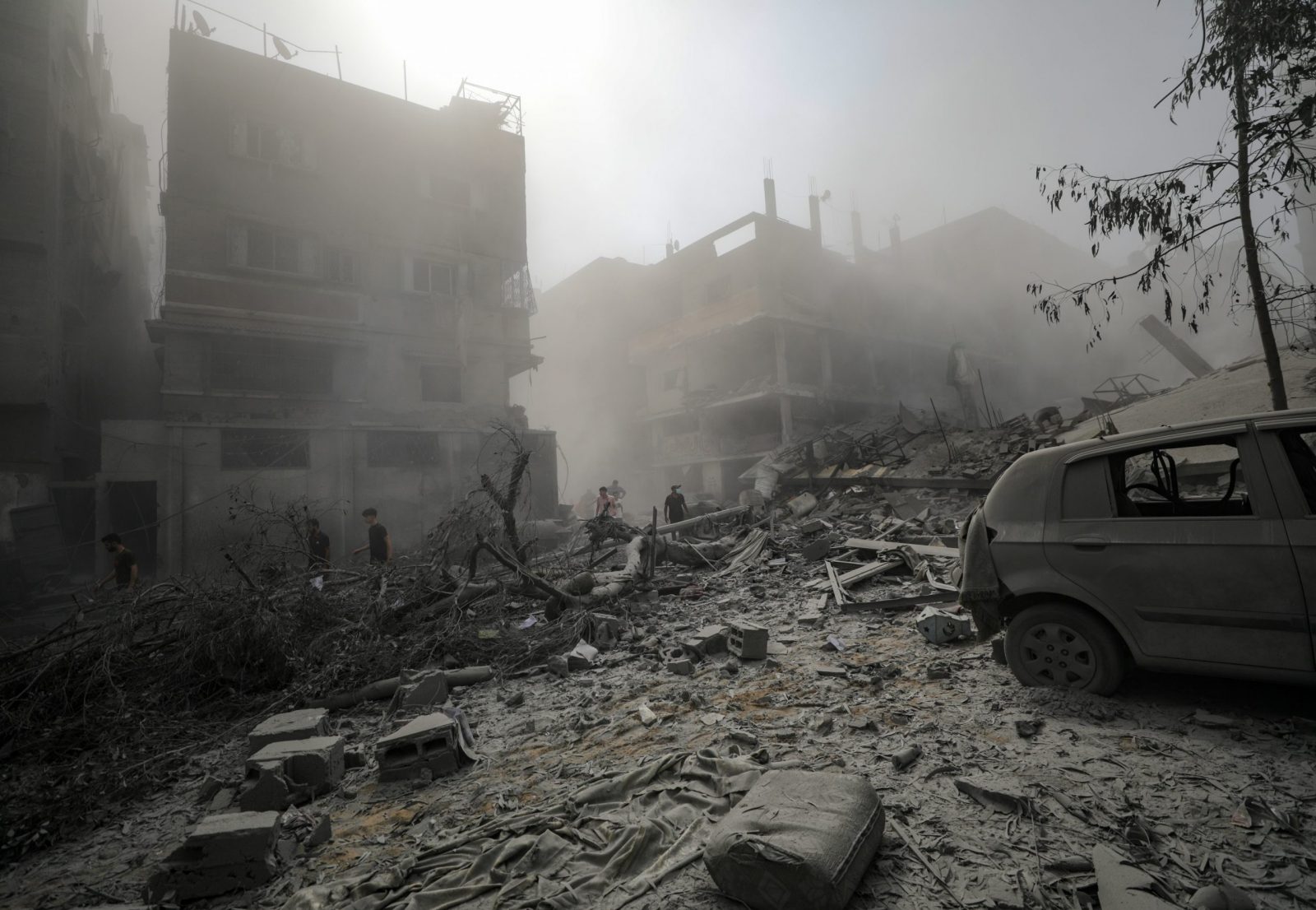 epa10934081 Palestinians walk through a destroyed area after Israeli air strikes in Gaza City, 23 October 2023. More than 4,700 Palestinians and over 1,400 Israelis have been killed, according to the Israel Defense Forces (IDF) and the Palestinian health authority, since Hamas militants launched an attack against Israel from the Gaza Strip on 07 October.  EPA/MOHAMMED SABER