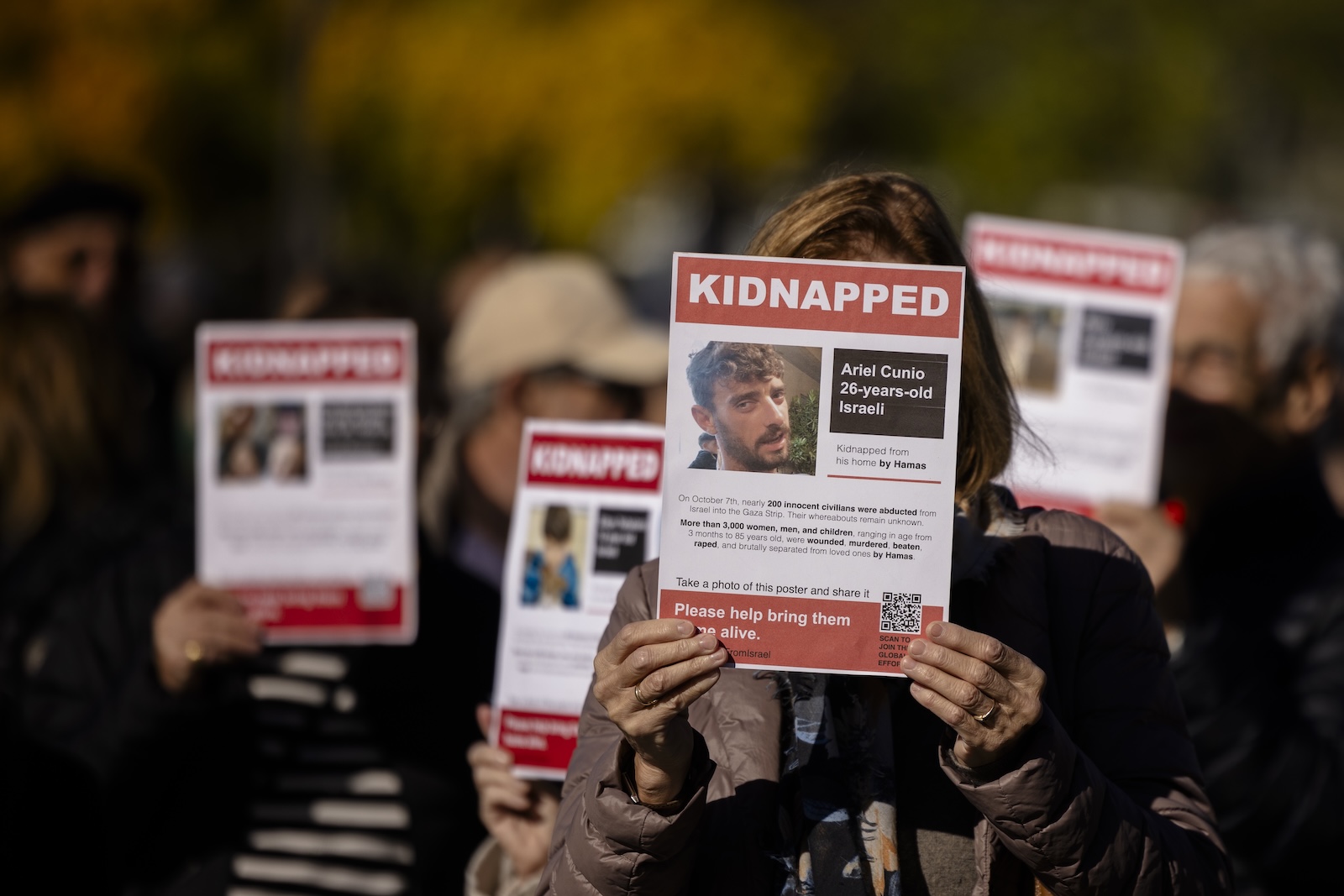 epa10944722 People hold placards showing portraits of Israeli hostages kidnapped by Hamas militants, during a protest on the  Sechselaeuten square in front of the Opera House in Zurich, Switzerland, 28 October 2023. Thousands of Israelis and Palestinians have died since the militant group Hamas launched an unprecedented attack on Israel from the Gaza Strip on 07 October, and the Israeli strikes on the Palestinian enclave which followed it.  EPA/MICHAEL BUHOLZER