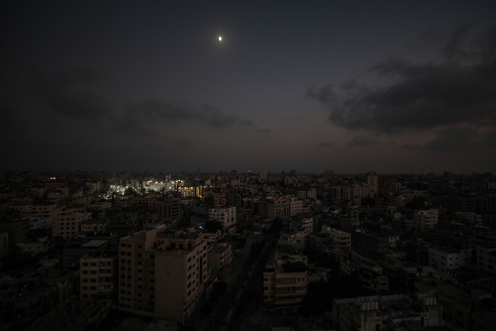 epa10936620 Al Shifa hospital is lit up in Gaza City 24 October 2023. The Health Ministry in Gaza warned that electric generators in hospitals will cease functioning within days due to a fuel shortage and that 32 health centers are out of service due to targeting by Israeli warplanes and a fuel shortage. More than 5,000 Palestinians and over 1,400 Israelis have been killed, according to the Israel Defense Forces (IDF) and the Palestinian health authority, since Hamas militants launched an attack against Israel from the Gaza Strip on 07 October.  EPA/MOHAMMED SABER