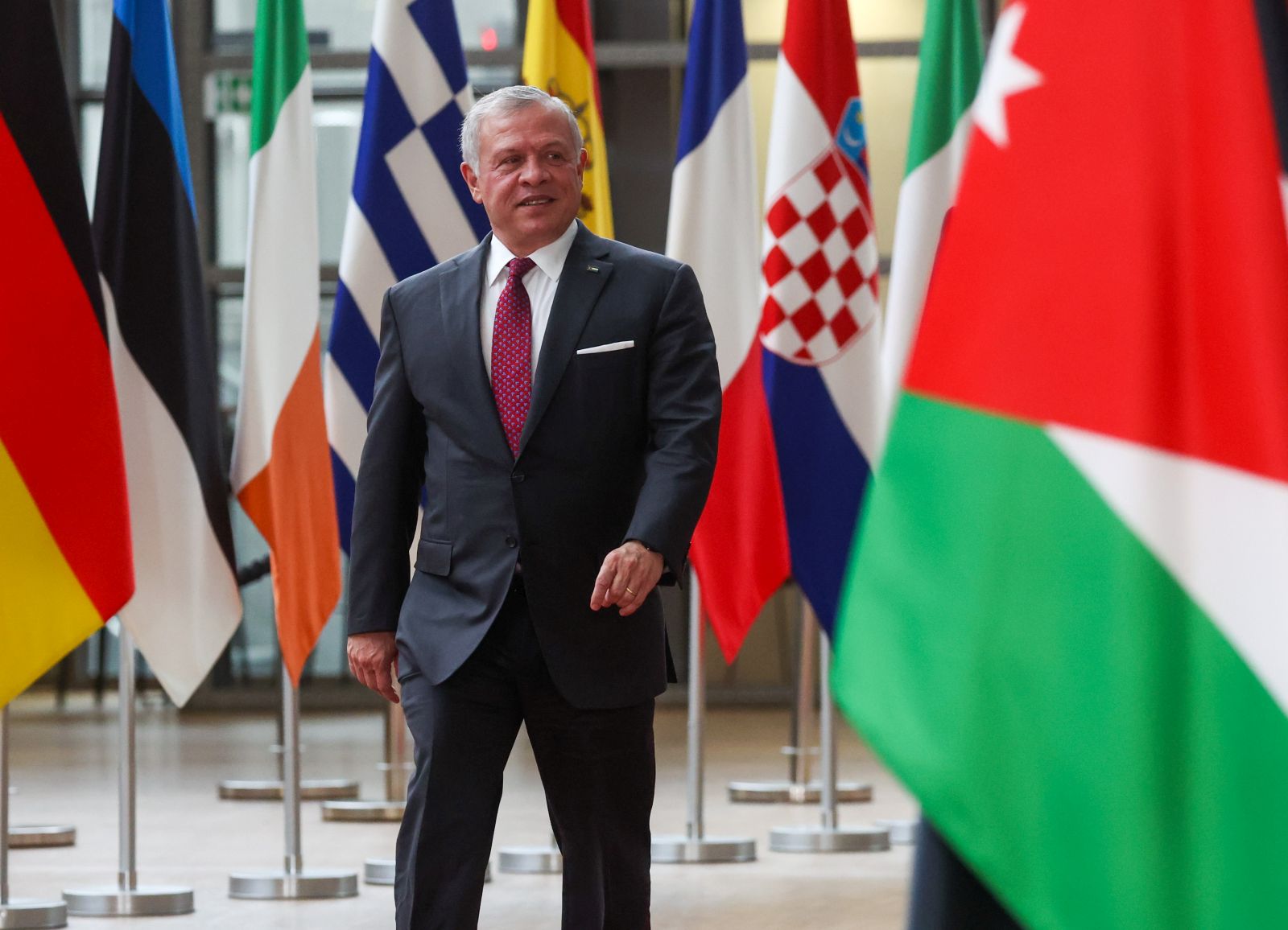 epa10961928 King Abdullah II bin Al-Hussein, King of the Hashemite Kingdom of Jordan, arrives for a visit to European Council President Charles Michel prior to their meeting in Brussels, Belgium, 07 November 2023. Jordan's King Abdullah arrived in Brussels on 06 November to meet with officials from the European Union, NATO, and the Belgian government.  EPA/OLIVIER HOSLET