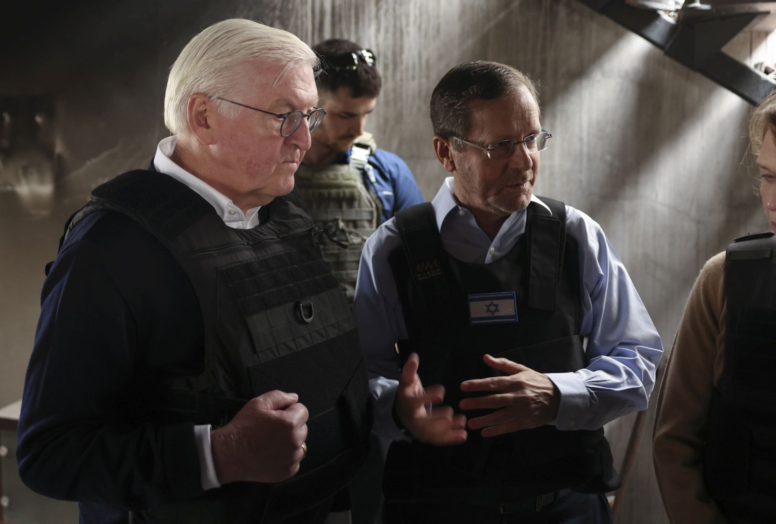 epa10997355 Israel's President Isaac Herzog (R) and German President Frank-Walter Steinmeier (R) visit Kibbutz Beeri following the deadly October 7 attack by gunmen from Palestinian militant group Hamas from the Gaza Strip, in southern Israel, 27 November 2023.  EPA/RONEN ZVULUN / POOL