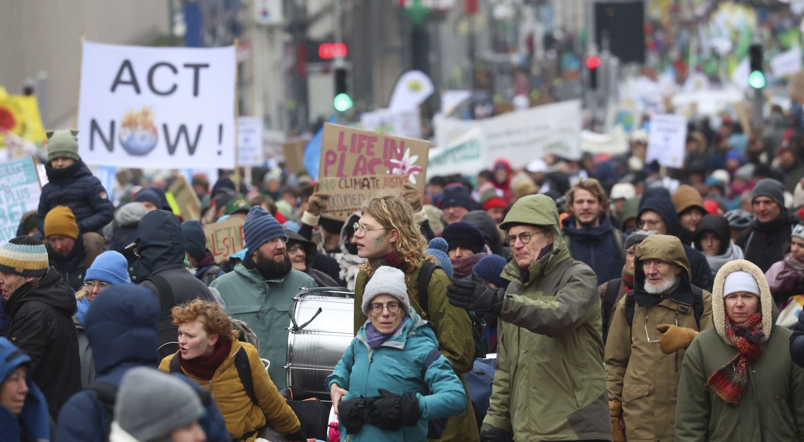 epa11009016 People hold placards during the annual Big Climate March 2023, in Brussels, Belgium, 03 December 2023. The protest, coinciding with the 2023 United Nations Climate Change Conference (COP28) in Dubai, is calling for urgent measures to combat climate change.  EPA/OLIVIER HOSLET