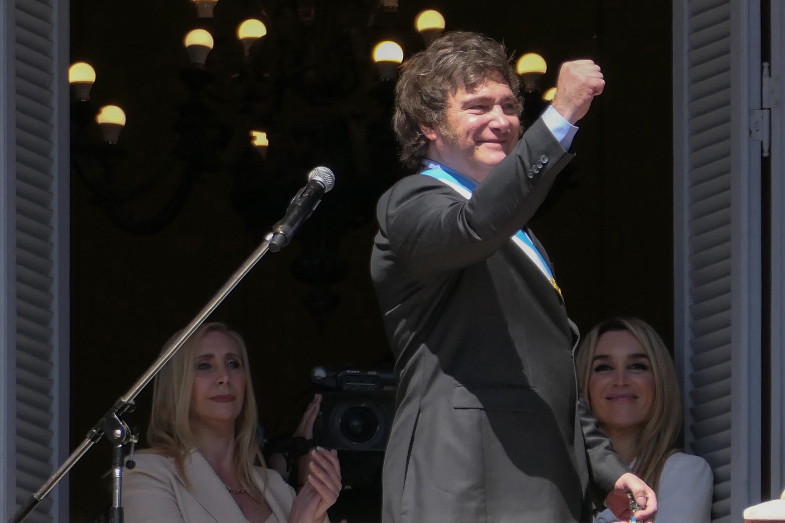 epa11022276 The president of Argentina, Javier Milei, gestures at the end of his speech on the balcony of the Casa Rosada in Buenos Aires, Argentina, 10 December 2023. Milei arrived at the Casa Rosada (seat of government) for the first time as head of state of the South American country, after taking the oath of office in Congress and delivering his speech to citizens. The leader of La Libertad Avanza (ultra-right) moved with his sister and main advisor, Karina Milei, in a convertible vehicle to the Plaza de Mayo, where, upon arriving at the Metropolitan Cathedral, he got out of the car and walked among the shouting of his followers.  EPA/Enrique García Medina