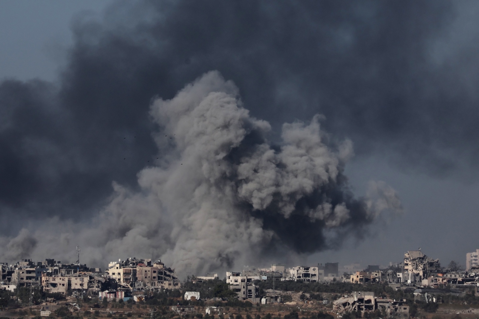 epaselect epa11022571 Smoke rises from the Gaza Strip following Israeli airstrikes, as seen from an undisclosed location near the border between Gaza and southern Israel, in Israel, 11 December 2023. More than 18,000 Palestinians and at least 1,200 Israelis have been killed, according to the Palestinian Health Ministry and the Israel Defense Forces (IDF), since Hamas militants launched an attack against Israel from the Gaza Strip on 07 October, and the Israeli operations in Gaza and the West Bank which followed it.  EPA/ABIR SULTAN