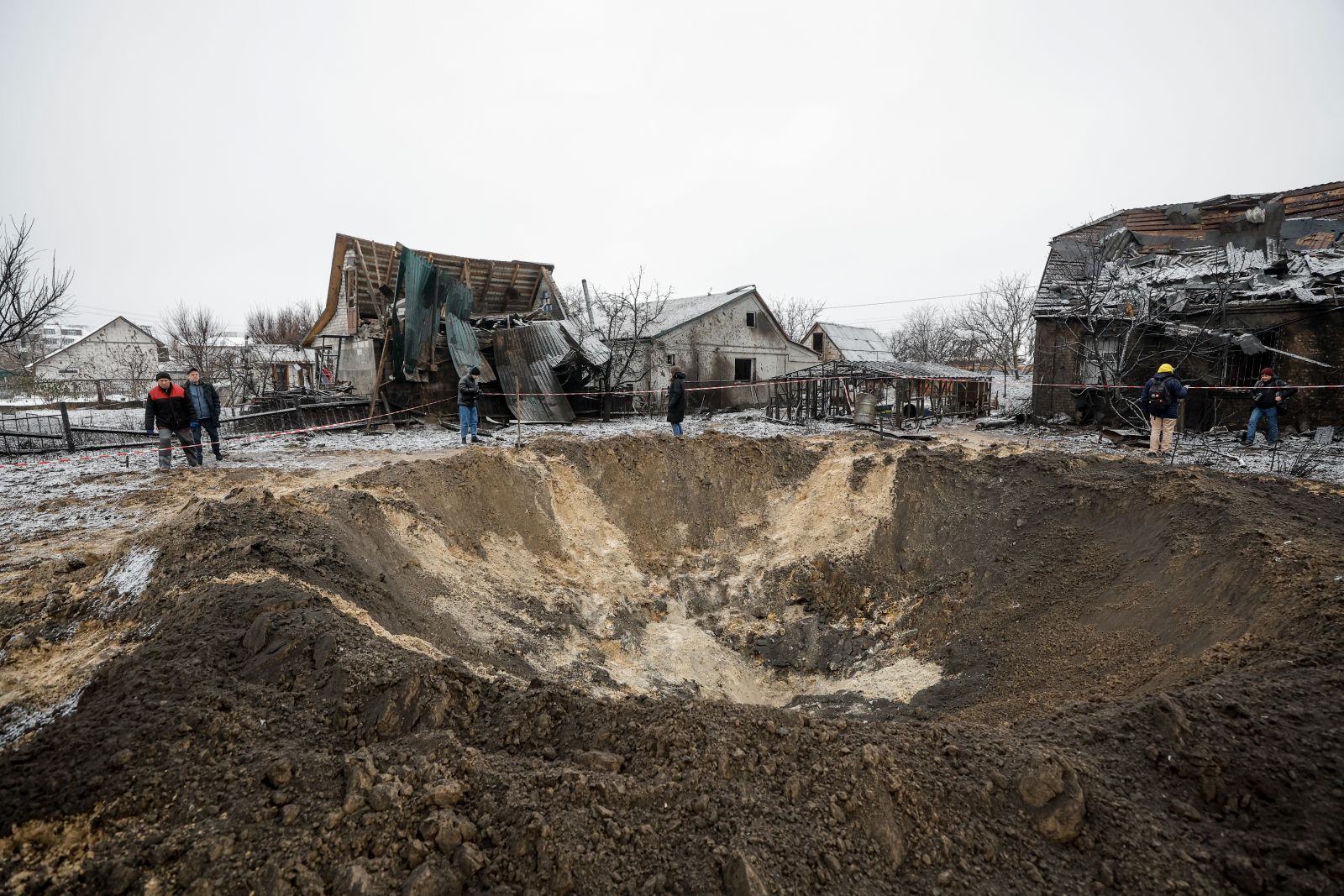 epa11022648 A crater caused by a Russian missile strike in Kyiv, Ukraine, 11 December 2023. Russia attacked the Kyiv region with eight ballistic missiles, all of which were reportedly shot down by air defenses.
The falling debris injured one man in his early 30s, and three women were diagnosed with an acute stress reaction due to the attack, said Serhii Popko, the head of the city's military administration.  EPA/Sergey Dolzhenko