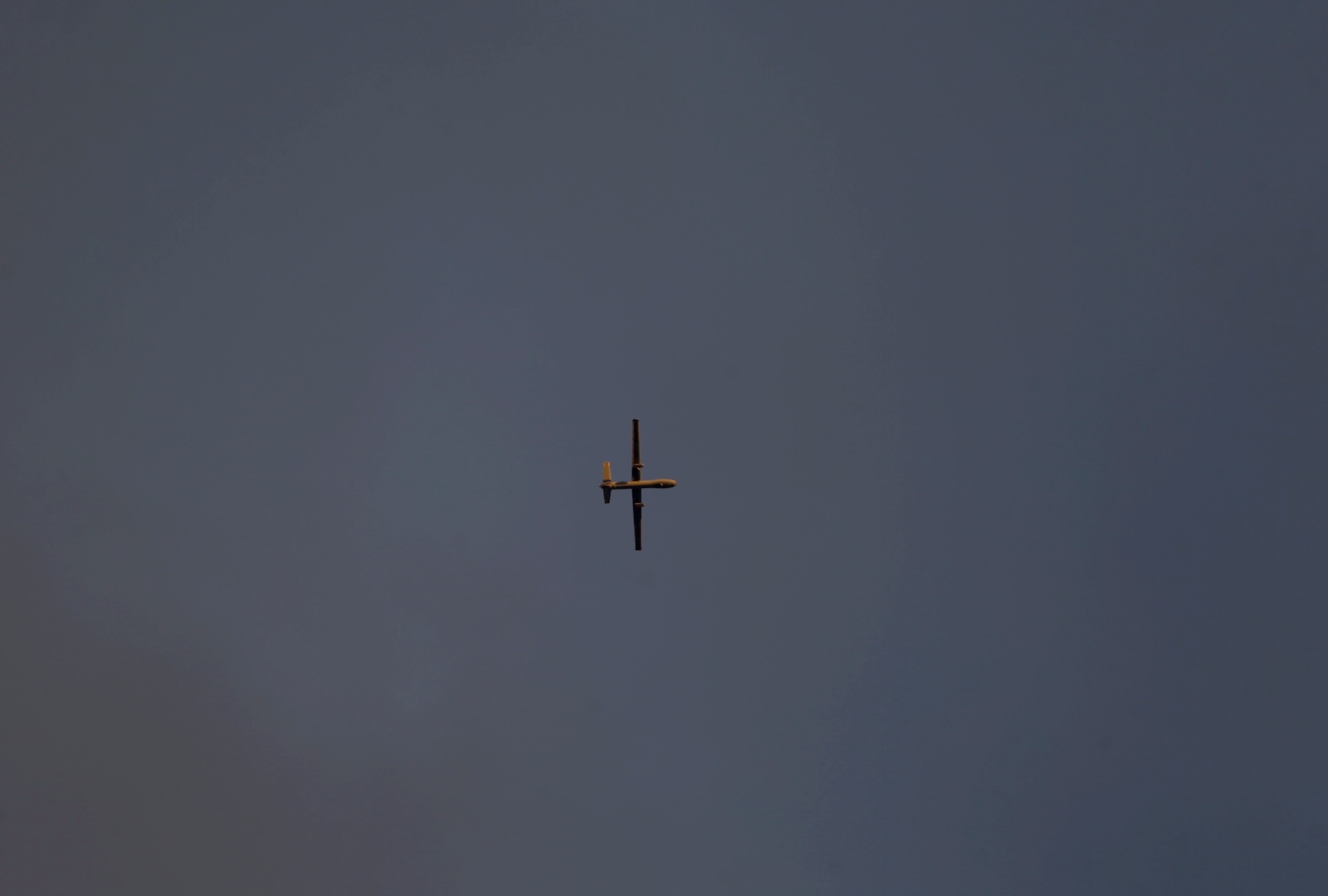 epa11040024 An Israeli drone flies in the sky above the town of Khan Younis, southern Gaza Strip, 21 December 2023. More than 19,600 Palestinians and at least 1,200 Israelis have been killed, according to the Palestinian Health Ministry and the Israel Defense Forces (IDF), since Hamas militants launched an attack against Israel from the Gaza Strip on 07 October, and the Israeli operations in Gaza and the West Bank which followed it.  EPA/MOHAMMED SABER