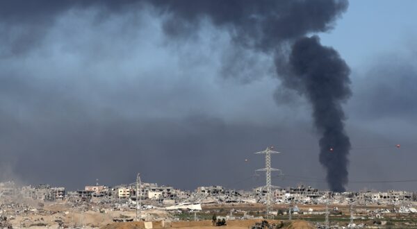 epa11047758 Israeli army soldiers stand guard at a position near the Israeli-Gaza border, as smoke rises above the Shujaiya neighborhood in the Gaza Strip, in southern Israel, 29 December 2023. More than 20,900 Palestinians and at least 1,300 Israelis have been killed, according to the Palestinian Health Ministry and the Israel Defense Forces (IDF), since Hamas militants launched an attack against Israel from the Gaza Strip on 07 October, and the Israeli operations in Gaza and the West Bank which followed it. The Israeli military stated that its ground, air, and naval troops are 'continuing to strike' targets in the Gaza Strip.  EPA/ATEF SAFADI