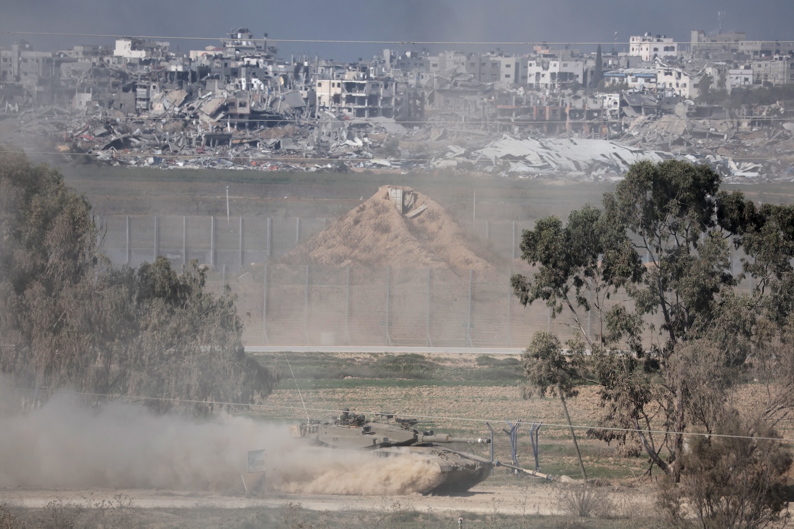 epa11052137 An Israeli tank maneuvers along the border with the Gaza Strip, in southern Israel, 01 January 2024. More than 21,600 Palestinians and at least 1,300 Israelis have been killed, according to the Palestinian Health Ministry and the Israel Defense Forces (IDF), since Hamas militants launched an attack against Israel from the Gaza Strip on 07 October, and the Israeli operations in Gaza and the West Bank which followed it. The Israeli military stated that its ground, air, and naval troops are 'continuing to conduct joint combat' across the Gaza Strip.  EPA/ABIR SULTAN