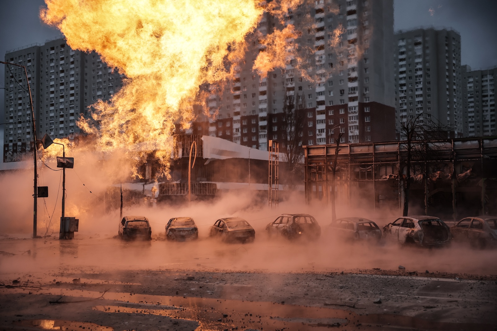 epa11053190 A view of a fire burning near a car dealership after a missile strike in Kyiv (Kiev), Ukraine, 02 January 2024, amid the Russian invasion. In the early hours of 02 January, Russia launched missile attacks targeting Kyiv and Kharkiv, local officials reported. At least two women were killed and nearly 70 others were injured in the two cities. In Kyiv, 27 people were hospitalized after a fire broke out in a multi-story building as a result of a rocket attack, the city mayor Vitali Klitschko wrote on telegram, adding that an injured elderly woman died in an ambulance. Some 130 residents were evacuated from the burning building, the State Emergency Service said.  EPA/OLEG PETRASYUK